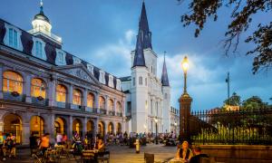 The Cabildo on the left, St Louis Cathedral on the background. French Quarter, fortune tellers in Jackson Square