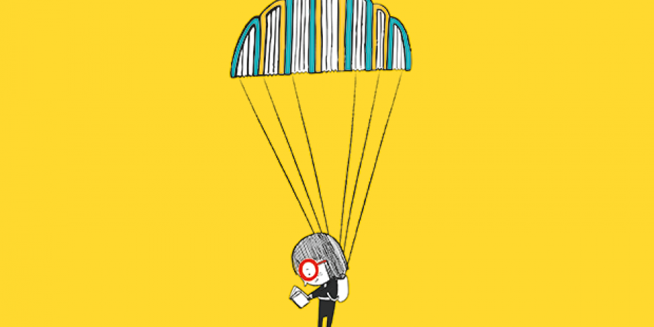 Mädchen mit Fallschirm liest ein Buch