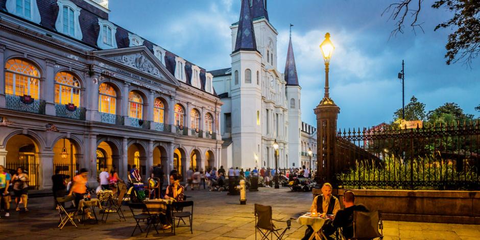 The Cabildo on the left, St Louis Cathedral on the background. French Quarter, fortune tellers in Jackson Square