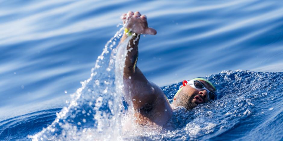 Neil Agius swimming in the ocean