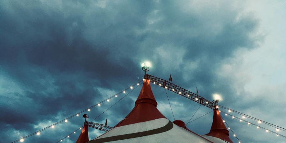 circus tent against cloudy skies