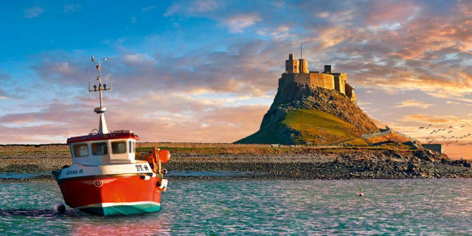 Lindisfarne Castle & fishing boat at sunset