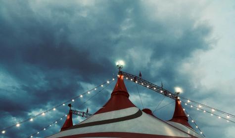 circus tent against cloudy skies